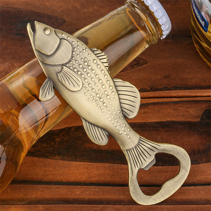 Fish bottle opener used to open a cold beer bottle at a backyard BBQ party