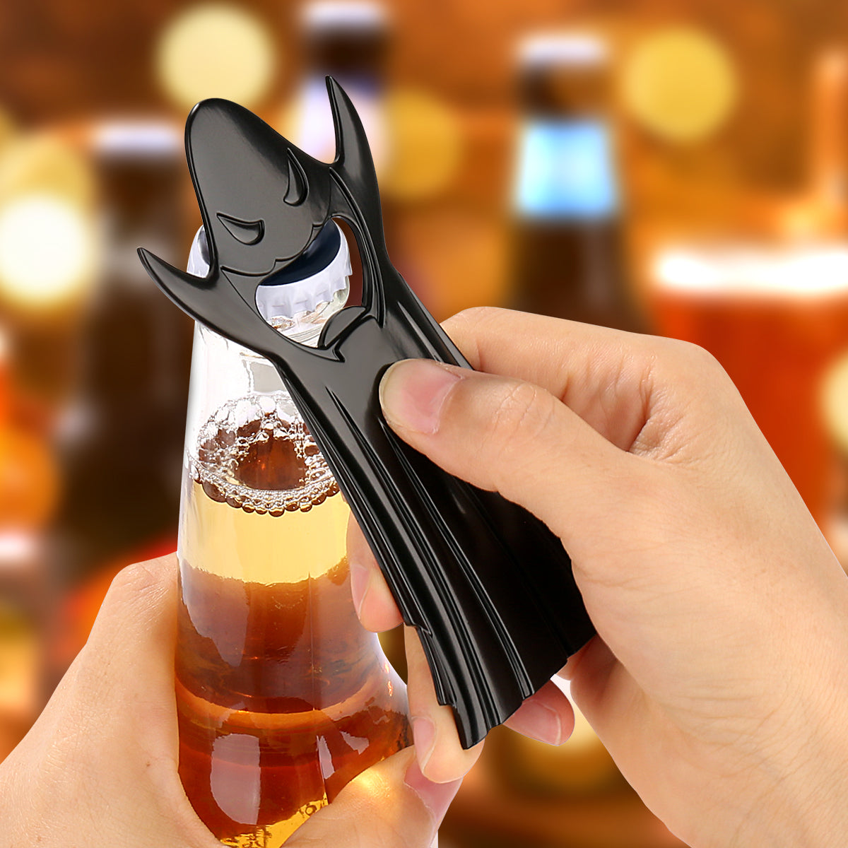 Ghost bottle opener used to open a cold beer bottle at a spooky-themed party